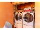 Functional laundry room with modern washer and dryer units for easy chores at 12212 N Paradise Vlg S Pkwy # 113, Phoenix, AZ 85032