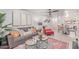 Inviting living room with stylish decor, plush seating, and a modern ceiling fan at 12212 N Paradise Vlg S Pkwy # 113, Phoenix, AZ 85032