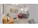 Bright living space with stylish seating, large window, and view of kitchen at 12212 N Paradise Vlg S Pkwy # 113, Phoenix, AZ 85032