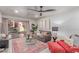 Comfortable living room with access to patio, modern décor, and ample natural light at 12212 N Paradise Vlg S Pkwy # 113, Phoenix, AZ 85032