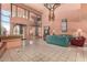 A large lobby area with tiled floors, sofas, artwork, and a staircase at 12212 N Paradise Vlg S Pkwy # 113, Phoenix, AZ 85032