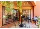 Comfortable outdoor patio featuring sliding glass doors and stylish seating at 12212 N Paradise Vlg S Pkwy # 113, Phoenix, AZ 85032