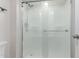 Clean and modern shower with frosted glass doors and chrome fixtures at 12212 N Paradise Vlg S Pkwy # 113, Phoenix, AZ 85032