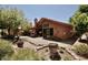 Beautiful backyard with a cozy patio, landscaped garden, and desert plants at 12965 N 95Th Way, Scottsdale, AZ 85260