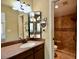 Bathroom featuring single sink, mirror and tile shower at 12965 N 95Th Way, Scottsdale, AZ 85260