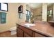Bathroom with granite countertops, sink, and mirror reflecting tiled walk-in shower at 12965 N 95Th Way, Scottsdale, AZ 85260