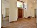 Open foyer showcasing tile floors, a high ceiling and a front door at 12965 N 95Th Way, Scottsdale, AZ 85260