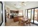 A kitchen and dining nook combo featuring tile floors and views of the patio at 12965 N 95Th Way, Scottsdale, AZ 85260