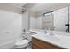 Bathroom featuring tub shower, a sink with storage, and ample lighting at 13723 W Rovey Ave, Litchfield Park, AZ 85340