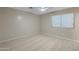Inviting bedroom featuring neutral walls and carpet, with a window providing natural light at 13723 W Rovey Ave, Litchfield Park, AZ 85340