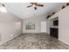 Spacious living room boasts an electric fireplace, open concept, and neutral colors at 13723 W Rovey Ave, Litchfield Park, AZ 85340