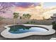 Private backyard features pool and lush desert landscaping at 13723 W Rovey Ave, Litchfield Park, AZ 85340