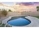 Sparkling swimming pool surrounded by patio with block wall for privacy at 13723 W Rovey Ave, Litchfield Park, AZ 85340