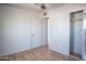 Bedroom featuring neutral walls, wood floors, closet, and a ceiling fan at 1410 S 24Th Ave, Phoenix, AZ 85009