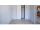 Empty bedroom shows sliding door closet, neutral gray walls, and tile flooring at 1410 S 24Th Ave, Phoenix, AZ 85009