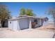 Side and front of a cute single-story home with concrete parking and greenery at 1410 S 24Th Ave, Phoenix, AZ 85009