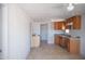 Spacious kitchen with modern brown cabinets, and a ceiling fan at 1410 S 24Th Ave, Phoenix, AZ 85009