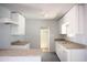 Bright kitchen with white cabinets, stainless steel sink and updated countertops at 1410 S 24Th Ave, Phoenix, AZ 85009