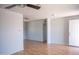Spacious living room featuring neutral walls, vinyl plank flooring, and a large front door at 1410 S 24Th Ave, Phoenix, AZ 85009