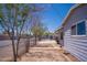The home features a simple yard with chainlink fence and trees lining the side at 1410 S 24Th Ave, Phoenix, AZ 85009