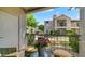Relaxing balcony view featuring wrought iron railing, furniture, and flowerpot with a clear view of the property at 14145 N 92Nd St # 1084, Scottsdale, AZ 85260