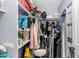 Overstuffed walk-in closet with shelving and hanging storage space at 14145 N 92Nd St # 1084, Scottsdale, AZ 85260
