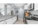 Modern kitchen featuring stainless steel appliances, granite countertops, white cabinets, and a stylish backsplash at 14145 N 92Nd St # 1084, Scottsdale, AZ 85260