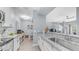 Open-concept kitchen with stainless steel appliances, granite countertops, and seamless flow into the living area at 14145 N 92Nd St # 1084, Scottsdale, AZ 85260