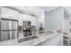 Modern kitchen with stainless steel appliances, granite countertops, and ample storage at 14145 N 92Nd St # 1084, Scottsdale, AZ 85260