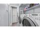 A well-lit laundry room with washer, dryer, storage and folding area at 14145 N 92Nd St # 1084, Scottsdale, AZ 85260