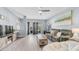 Bright living room featuring stylish furniture, modern decor, ceiling fan, and access to a balcony at 14145 N 92Nd St # 1084, Scottsdale, AZ 85260