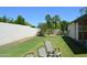 Relaxing backyard featuring green grass, privacy wall, and shade trees at 14626 N 40Th Way, Phoenix, AZ 85032