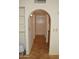 Hallway with tile floor and archway into kitchen at 14626 N 40Th Way, Phoenix, AZ 85032