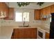 Well-lit kitchen with a window over the sink and modern appliances at 14626 N 40Th Way, Phoenix, AZ 85032