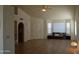 Open living room with tile flooring and large windows for lots of natural light at 14626 N 40Th Way, Phoenix, AZ 85032