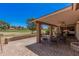 Tranquil back patio overlooking the golf course featuring comfortable seating and mature trees at 1473 Leisure World --, Mesa, AZ 85206