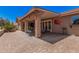 Comfortable back patio area features stone pavers, mature trees, and an outdoor grilling area at 1473 Leisure World --, Mesa, AZ 85206