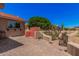 Private back yard features custom grilling area, mature trees, and beautiful stone pavers at 1473 Leisure World --, Mesa, AZ 85206