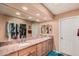 Well-lit bathroom featuring dual sinks and granite countertops at 1473 Leisure World --, Mesa, AZ 85206
