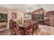 Formal dining room with wooden table, chairs, and elegant chandelier at 1473 Leisure World --, Mesa, AZ 85206