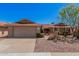 Charming single-level home with desert landscaping, mature trees, and a two-car garage at 1473 Leisure World --, Mesa, AZ 85206