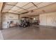 Spacious garage with epoxy flooring, storage cabinets, golf cart, and bicycle at 1473 Leisure World --, Mesa, AZ 85206