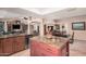 Open concept kitchen featuring an island and seamless flow into the dining area at 1473 Leisure World --, Mesa, AZ 85206