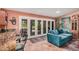 Bright sunroom featuring a cozy seating area and access to the backyard patio at 1473 Leisure World --, Mesa, AZ 85206