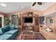 Bright living room featuring comfortable seating, a patterned rug, and a large entertainment center at 1473 Leisure World --, Mesa, AZ 85206