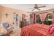 Serene main bedroom with a ceiling fan and private access to outdoor patio at 1473 Leisure World --, Mesa, AZ 85206