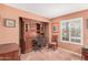 Office space with built-in shelves, desk area, tile flooring, and bright natural light at 1473 Leisure World --, Mesa, AZ 85206
