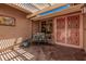 Cozy patio space with comfortable seating, decorative metalwork, and a pergola at 1473 Leisure World --, Mesa, AZ 85206