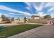 A spacious backyard with artificial grass, a playground, and a trampoline at 15339 N 148Th Ct, Surprise, AZ 85379