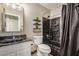 Bathroom with black and white marble finishes and modern fixtures at 15339 N 148Th Ct, Surprise, AZ 85379
